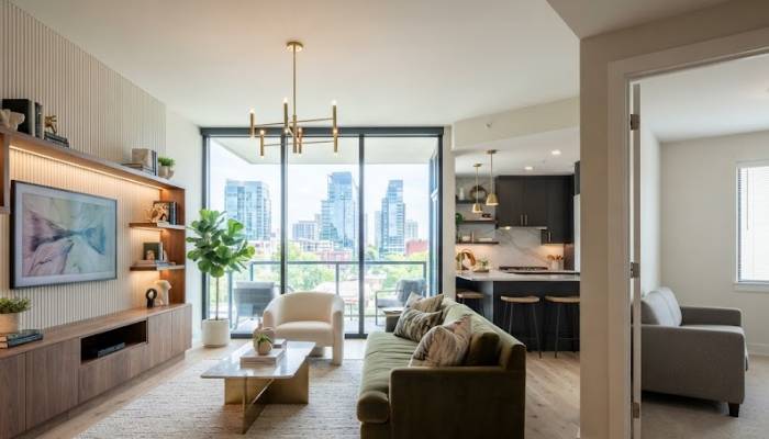 A stylish modern condo interior with custom upgrades compared to a standard neutral rental apartment living room.